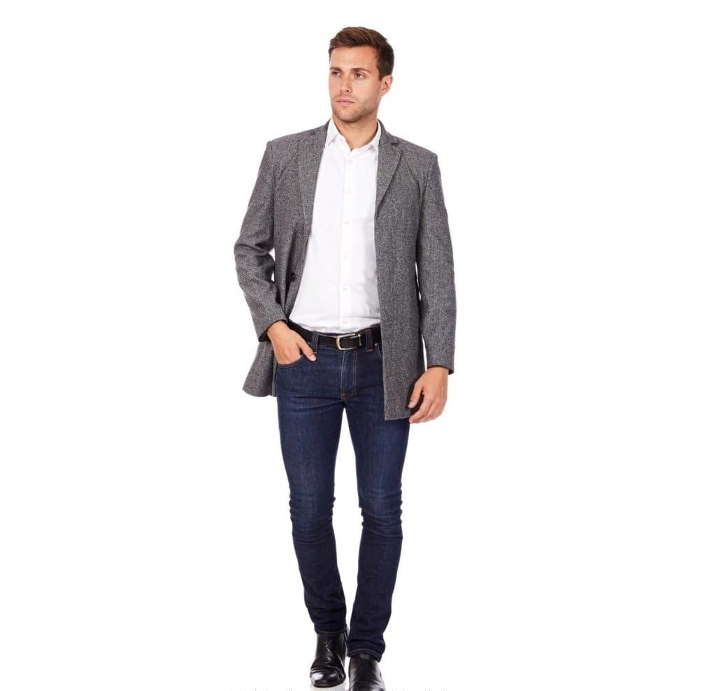 Man wearing a gray blazer, white shirt, and blue jeans on a white background with 'De La Creme Fashions' branding.